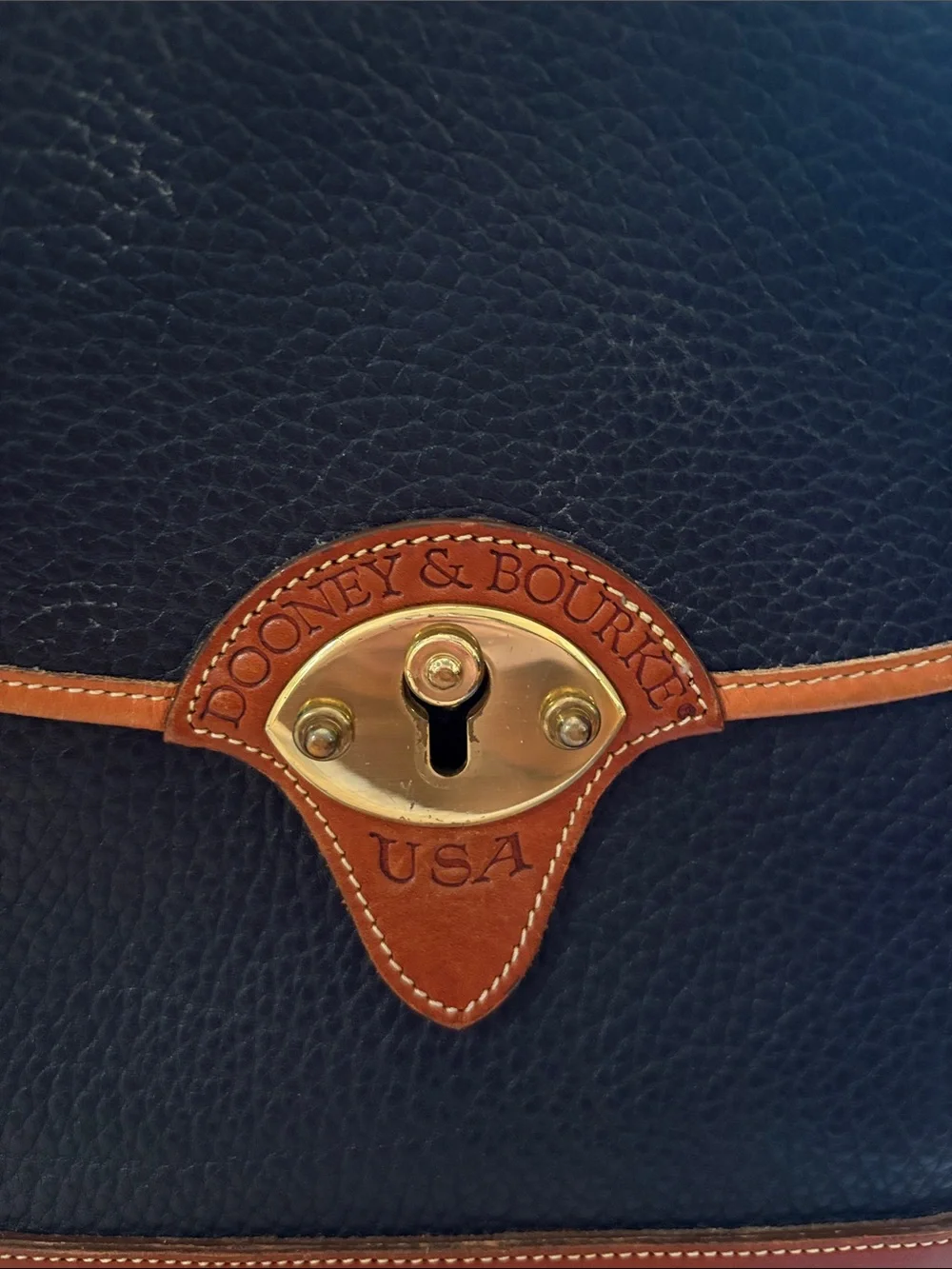 Dooney & Bourke Black with Brown Trim Pebbled Leather Messenger